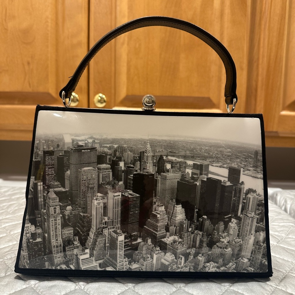 New York City handbag with kiss lock closure and protective feet. NWOT .